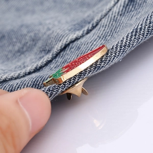 Chic strawberry enamel brooch on denim fabric with gold base and red drip oil finish