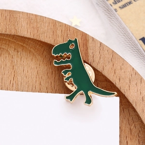 Cute green cartoon dinosaur enamel brooch pin with golden metal details for clothing decor