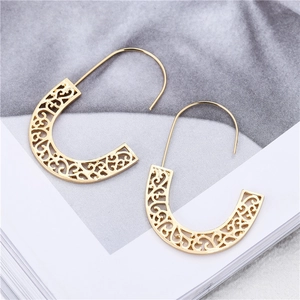 Elegant gold U-shaped hoop earrings featuring intricate vintage hollowed floral patterns