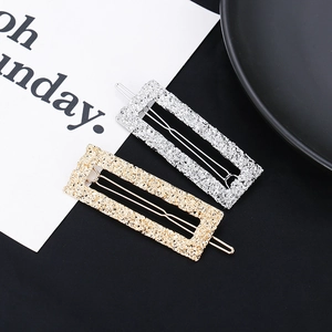 Textured gold and silver metal hair clips with unique hammered pattern for women