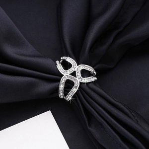 Elegant silver triangle crystal scarf ring clip with rhinestones on blue satin background