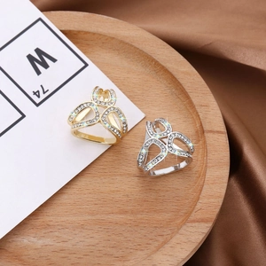 Close-up of triangle crystal scarf ring with hollow design and silver-gold plating