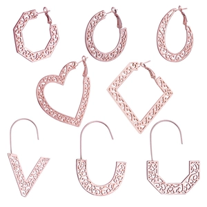 Eight pairs of rose gold hollow geometric earrings with intricate swirl patterns and hooks