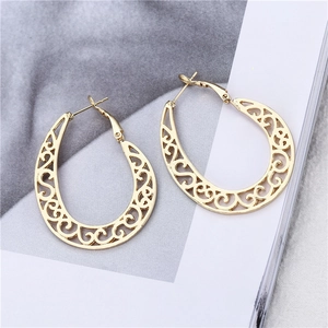 Ethnic vintage hollow gold earrings with intricate floral patterns and drop silhouette