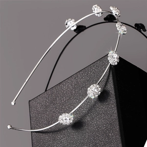 Elegant silver thin headband with round rhinestones displayed on a premium black gift box