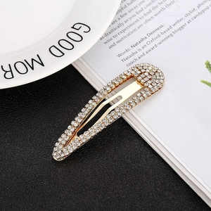 Elegant gold rhinestone hair clips set featuring oval sparkling crystal bobby pins for women