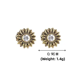 Detail view of sunflower stud earrings featuring vintage gold petals and crystal centers