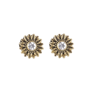 Fashionable gold sunflower stud earrings with white rhinestones on white background