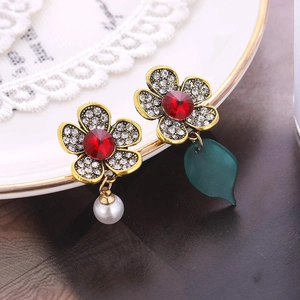 Vintage floral drop earrings with red zircon, crystals, pearl and green leaf detail