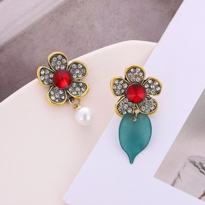 Asymmetric five-petal flower earrings with crystals, a white pearl and a green leaf drop