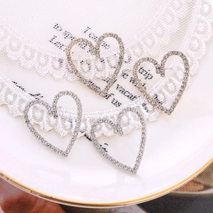 Elegant 925 silver and gold hollow heart stud earrings with sparkling pavé cubic zirconia