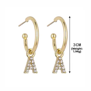 Detail of 3cm gold C-shape letter A earrings with rhinestones weighing 1.94g