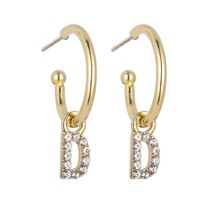 Detailed close-up of gold hoop earrings with sparkling rhinestone-studded letter D pendant