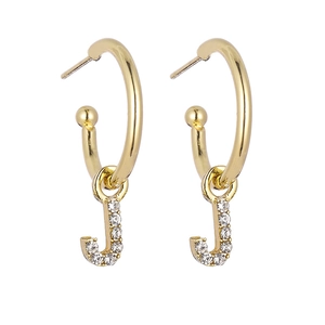 Close-up of golden letter J pendant earrings with sparkling pavé crystal accents