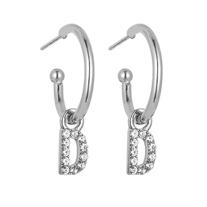 Macro view of silver letter D charm earrings with sparkling rhinestones and hoop design