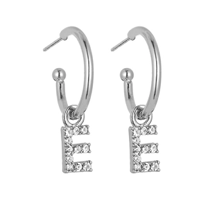 Detail view of silver letter E hoop earrings with sparkling pave-set crystals