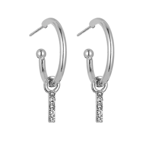 Detail of silver C-shape earrings with long vertical drops and five sparkling zircons