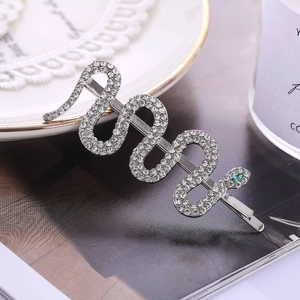 Silver snake hair clip with white rhinestones and green crystal eye for women