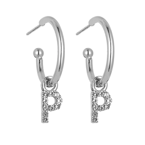 Detail of silver letter P hoop earrings with pavé crystal settings and 925 silver needles