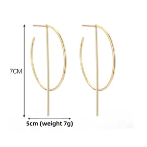 Minimalist gold geometric dangle earrings detail with 7cm height and 5cm width measurements