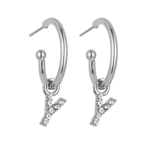 Close-up of silver hoop earrings with sparkling crystal letter Y charms and 925 silver pins
