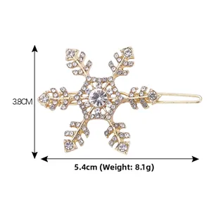 Detail of a gold snowflake hair clip with rhinestones, 5.4cm length and 8.1g weight