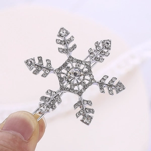 Macro view of snowflake hair clip with sparkling crystals and silver metal base detail