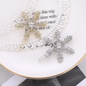 Elegant sparkling rhinestone snowflake hair clips set in gold and silver metal finishes