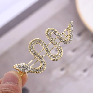 Elegante fermaglio per capelli a serpente dorato con strass lucenti e design a forma di S
