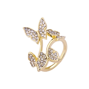 Sparkling gold butterfly ring with white rhinestones on a clean white background