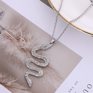 Elegant silver snake pendant necklace with sparkling rhinestones on a stylish O-chain