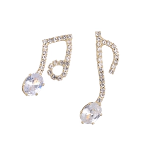 Elegant asymmetric music note stud earrings in gold with sparkling diamonds and clear gems