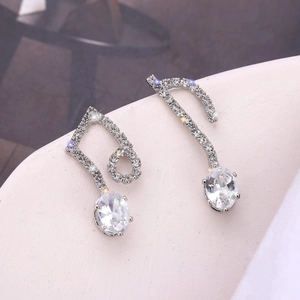 Elegant S925 silver music note earrings featuring white zircon pavé and asymmetrical design