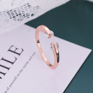 Elegant rose gold adjustable ring featuring dual round cubic zirconia in a minimalist style