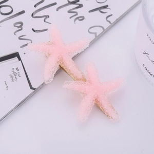 Pink starfish hair clips set with frosted sugar texture and gold duckbill base