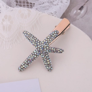 Macro shot of rose gold starfish hair clip adorned with multi-color rhinestones