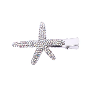 Close-up of starfish hair clip with colorful rhinestones and silver duckbill clip