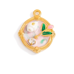 Detail showing gold frame pendant with pink marble enamel and intricate floral charm inlay