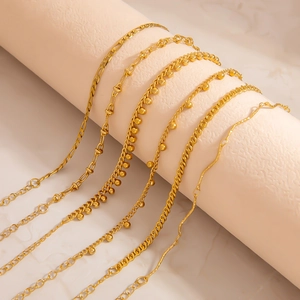 Set of six 18K gold stainless steel bracelets with beads and diverse chain textures