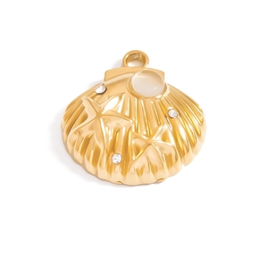 Detailed view of 18K gold scallop charm with starfish relief and white gemstone
