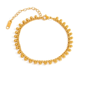 Detailed macro view of 18K gold-plated stainless steel ball chain with lobster clasp