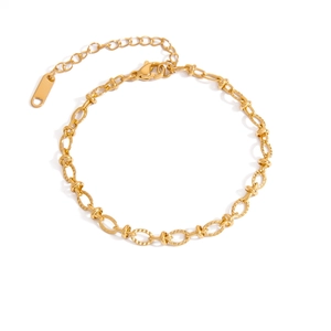 Detail of 18K gold stainless steel chain bracelet with textured oval links and lobster clasp