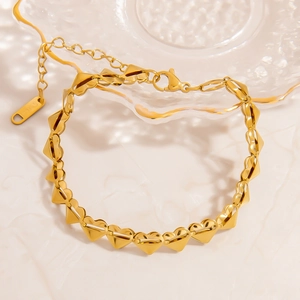 Detailed close-up of 18K gold-plated stainless steel heart link chain with lobster clasp