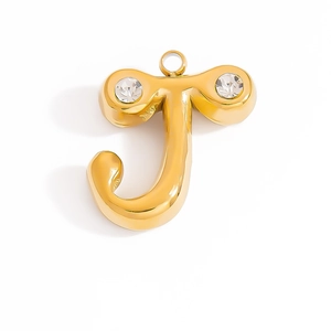 Detailed macro view of gold-plated letter J pendant with two sparkling cubic zirconia stones