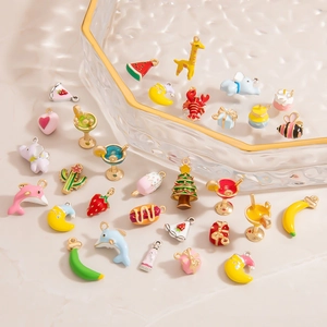 Detailed collection of assorted enamel fruit and animal charms for DIY jewelry making