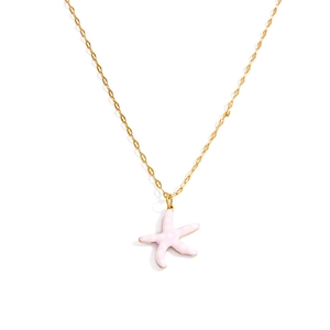 Detail of pink starfish pendant with white polka dots on a gold stainless steel chain