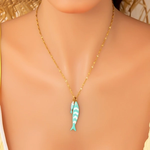 Detail of double fish pendants in blue and white enamel on a 18K gold plated chain