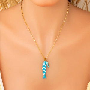 Detail of 18K gold stainless steel necklace with blue fish pendants on neck model