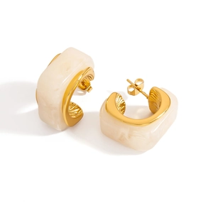Detail of vintage square hoop earrings with 18k gold frame and cream marble resin inlay