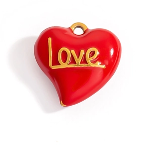 Red enamel heart charm with golden Love script and top ring on white background